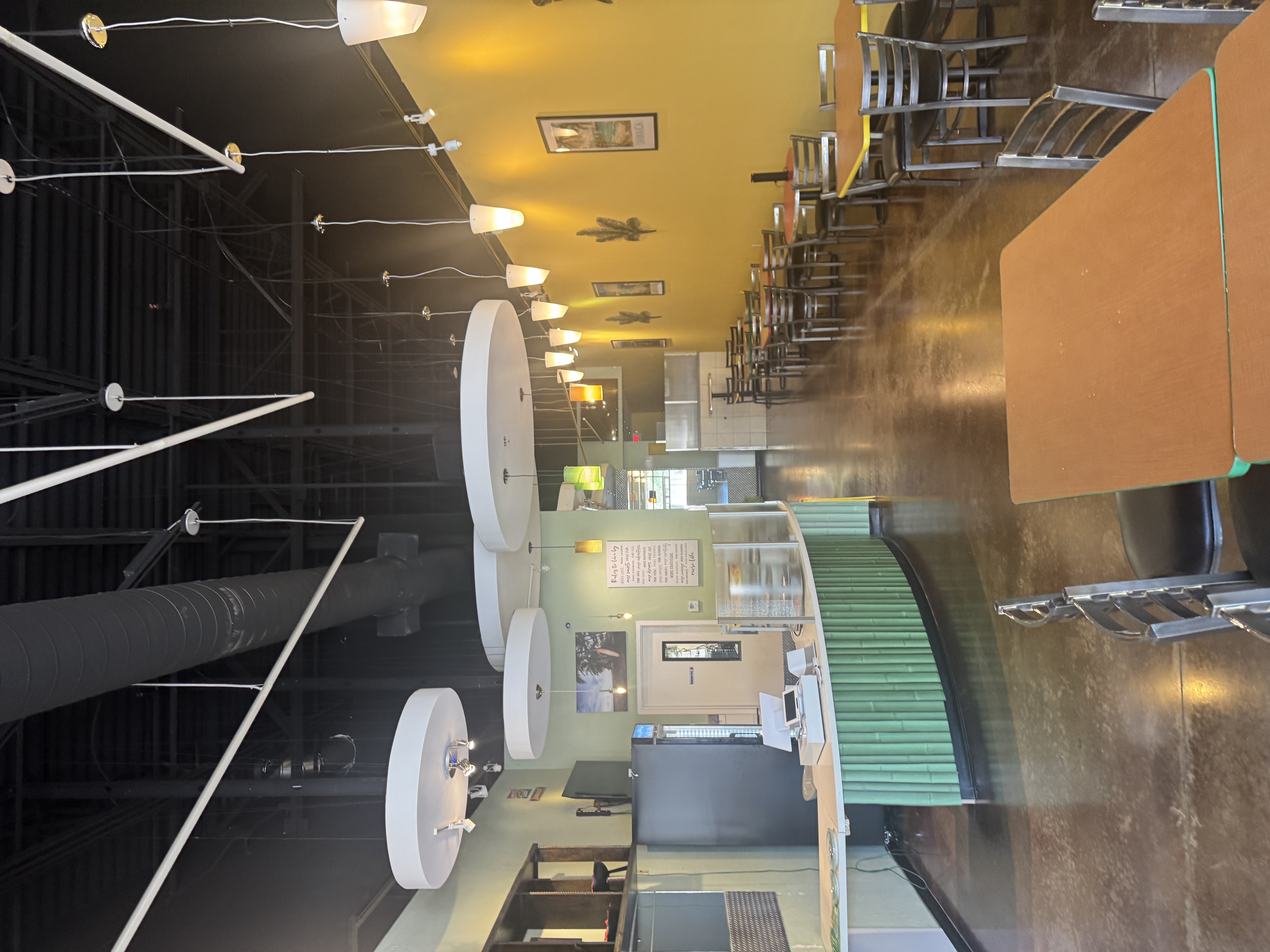 Seating and counter area inside Fiyahside Island Grill 2 in Little Rock, Arkansas