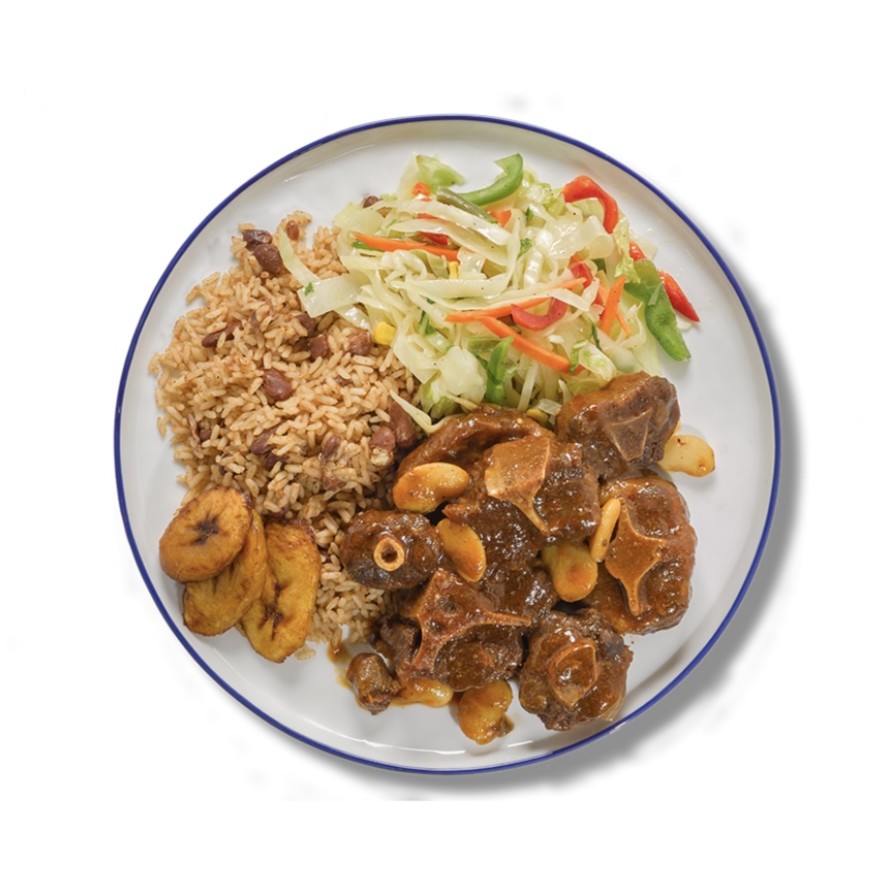 Oxtail plate with rice and peas and cabbage slaw