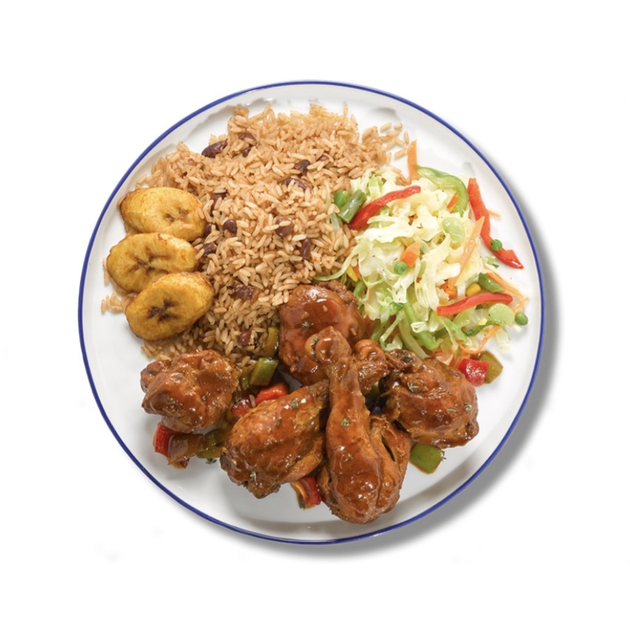 Brown Stew Chicken plate with rice and peas, fried plantain, and cabbage slaw