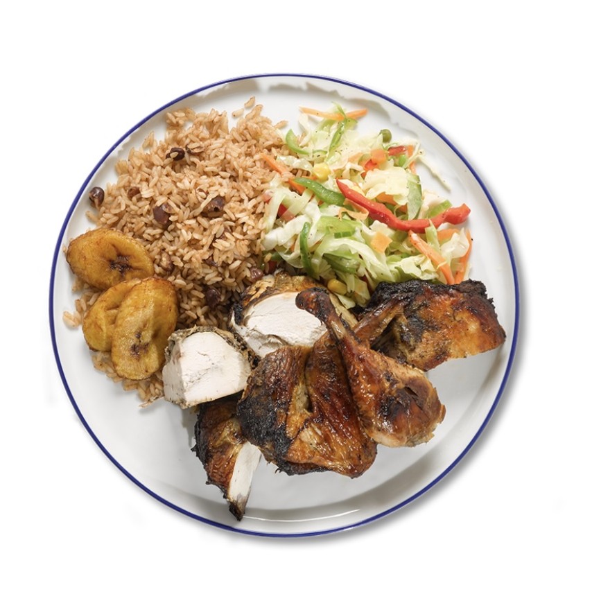 Jerk Chicken plate with rice and peas, fried plantain, and cabbage slaw
